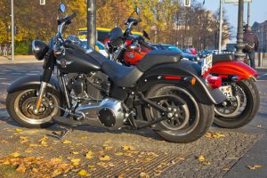 "Berlin, Germany - November 01, 2011: Two Harley Davidson motorcycles on the pavement in Berlin, Gremany. Harley Davidson is an American motorcycle manufacturer. Founded in Milwaukee, Wisconsin, during the first decade of the 20th century.The company sells heavyweight motorcycles designed for cruising on the highway."
